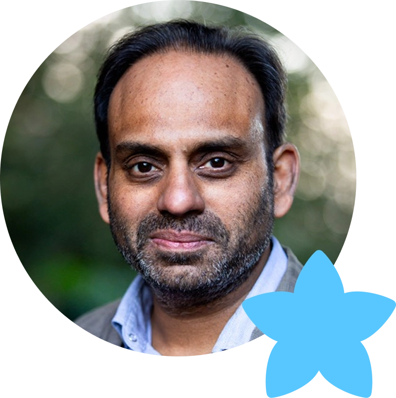 An image of writer Neil D'Souza in a circular frame